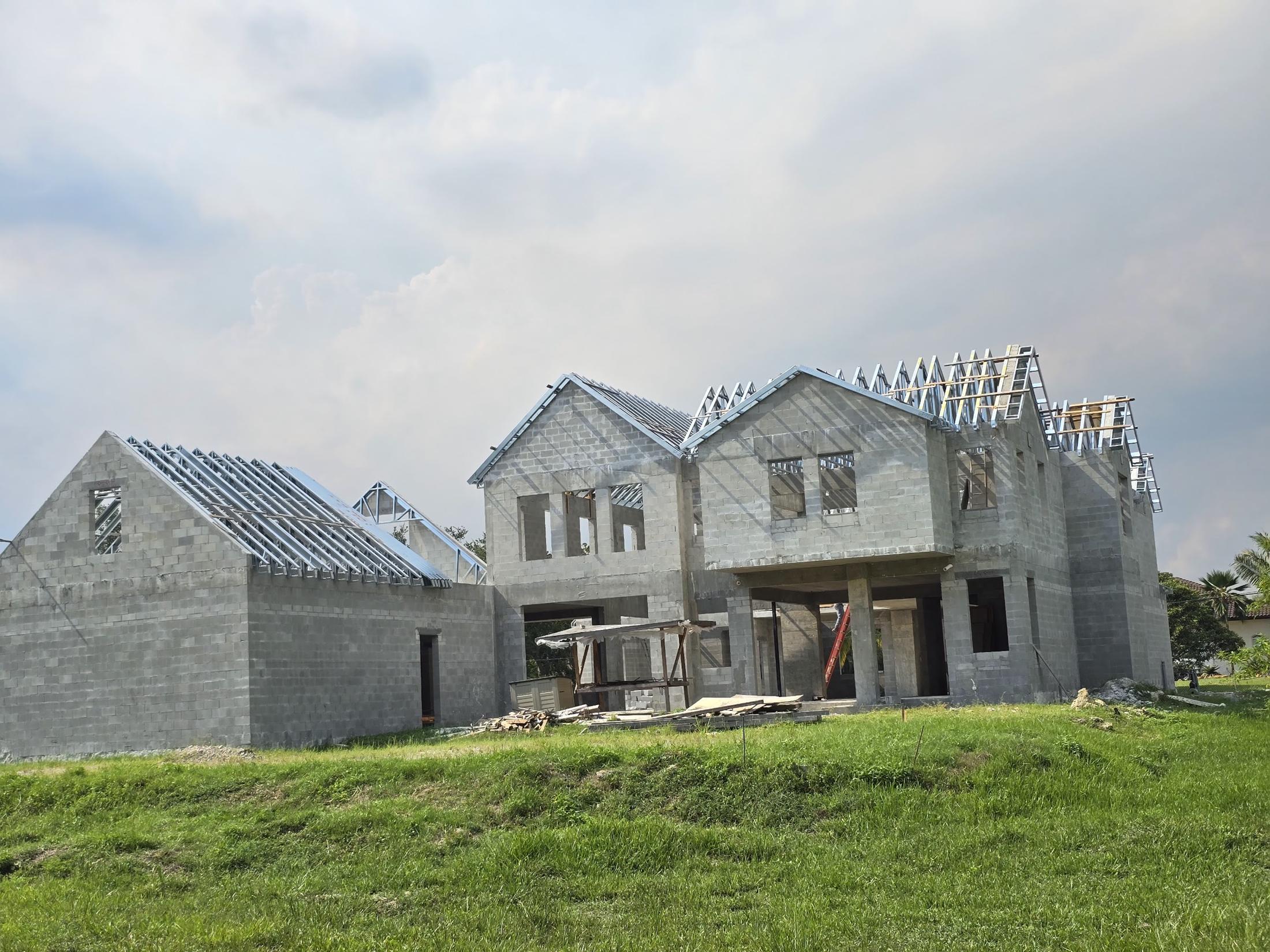 Block home with gable walls topped out